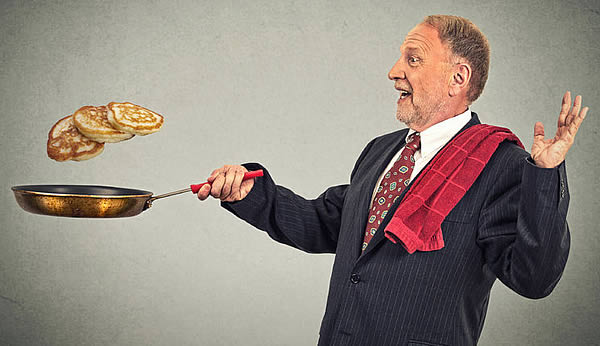 Man flipping pancake